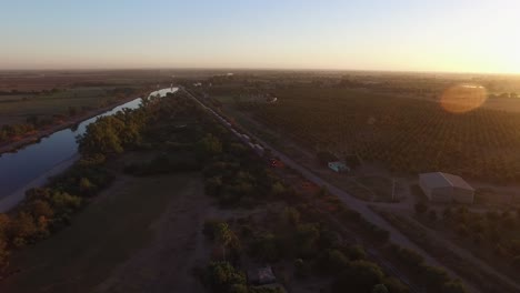 Aerial-shot-of-a-large-cargo-train-in-Sonora-at-Sunset