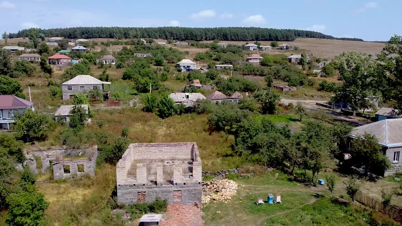 Nestled in the countryside, this abandoned village showcases weathered buildings, lush greenery, and remnants of past lives. Nature surrounds the area creating a quiet escape