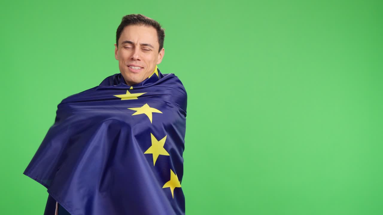 European man smiling wrapped in european union flag