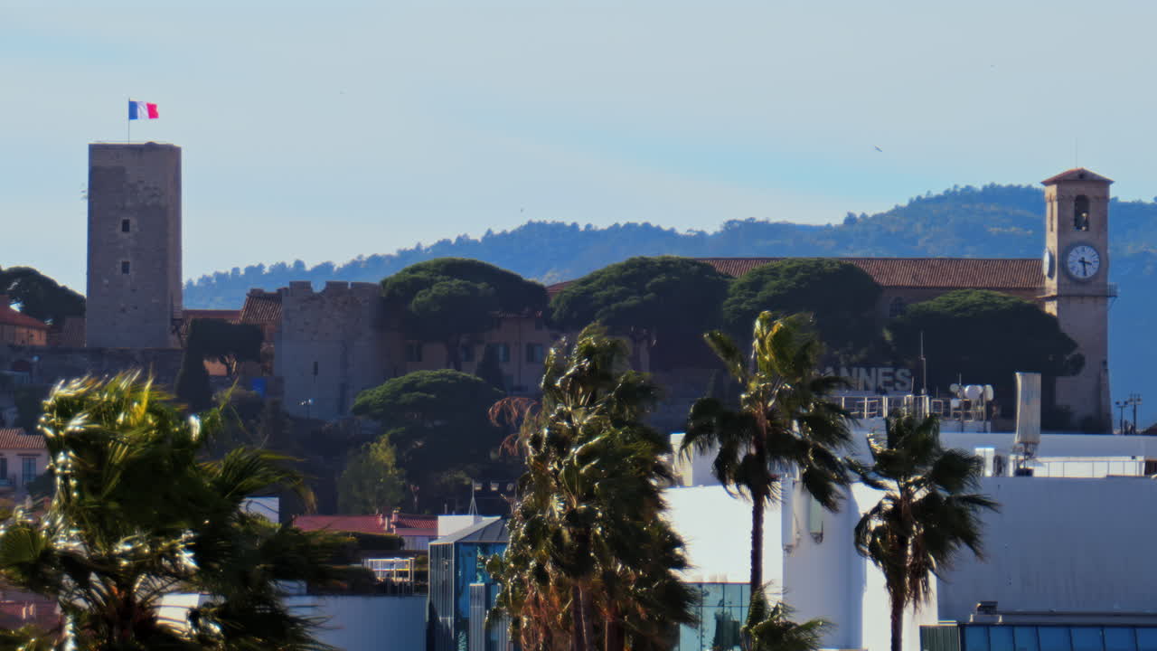 Distant view of the Goya Museum in Castres, France with the french flag on top of it