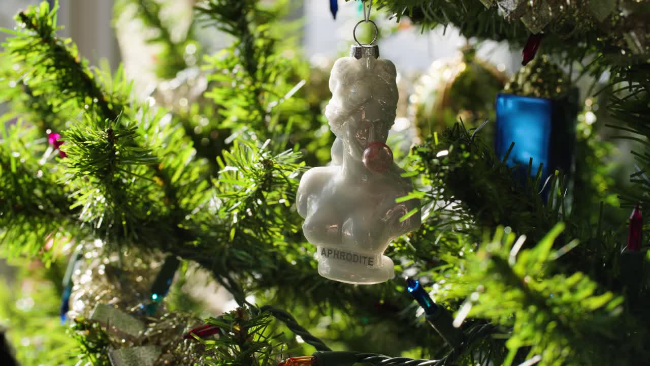 Christmas Tree Ornament hanging on fake Xmas tree: Aphrodite Statue blowing bubbles