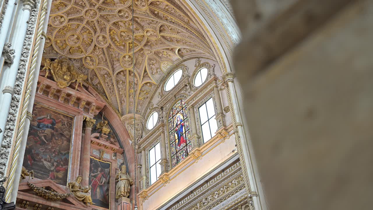 Inside the Cathedral-Mosque of Córdoba, the footage captures the breathtaking fusion of Islamic and Christian architectural styles.