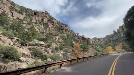 scenic road through chiricahua national monument with autumn colors on trees