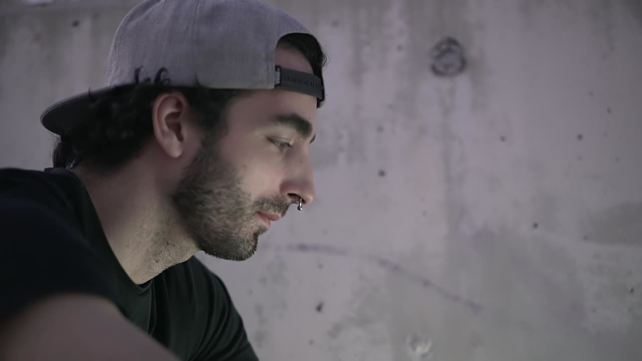 Person working on laptop outdoors with coffee