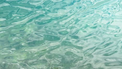 tropical blue ocean water with calm ripples, static view