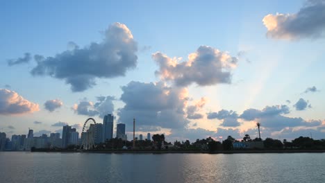 uae-dec 2020: timelapse of the grey clouds floating above the downtown buildings of khalid lagoon, sharjah, united arab emirate