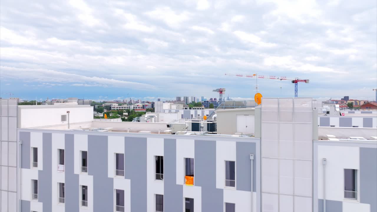 Modern Cityscape with Construction Crane and Residential Buildings