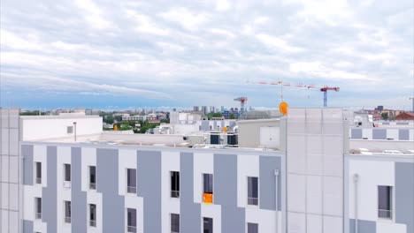 modern cityscape with construction crane and residential buildings