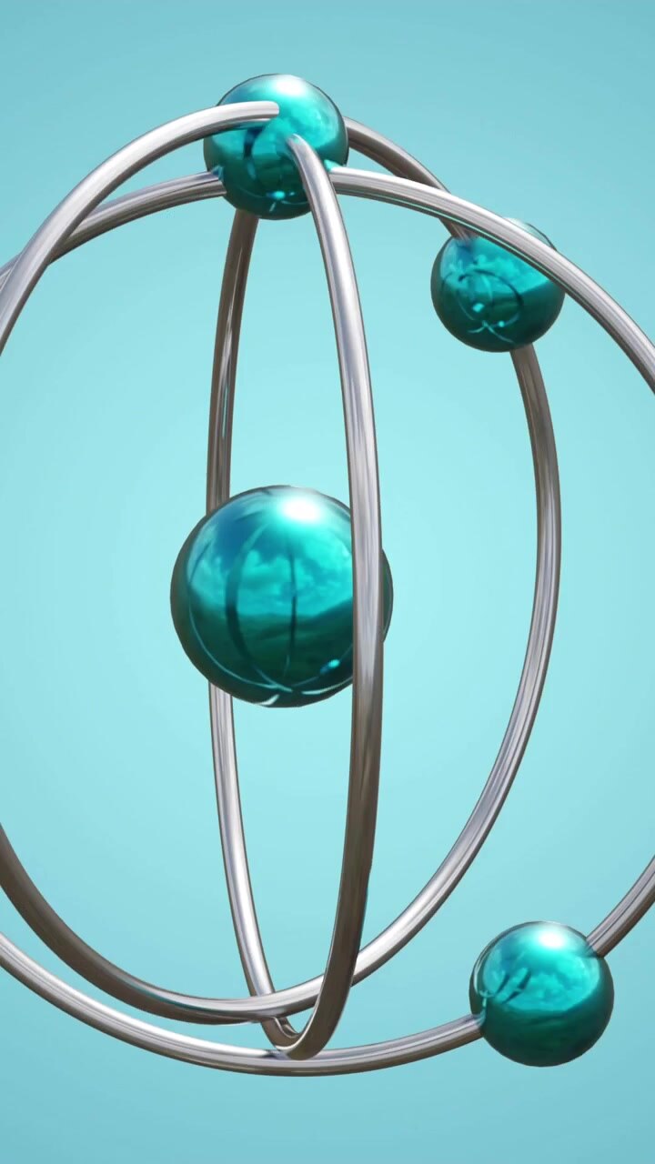 Animation of atom model spinning on blue background