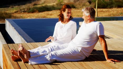 happy couple relaxing on wooden plank 4k