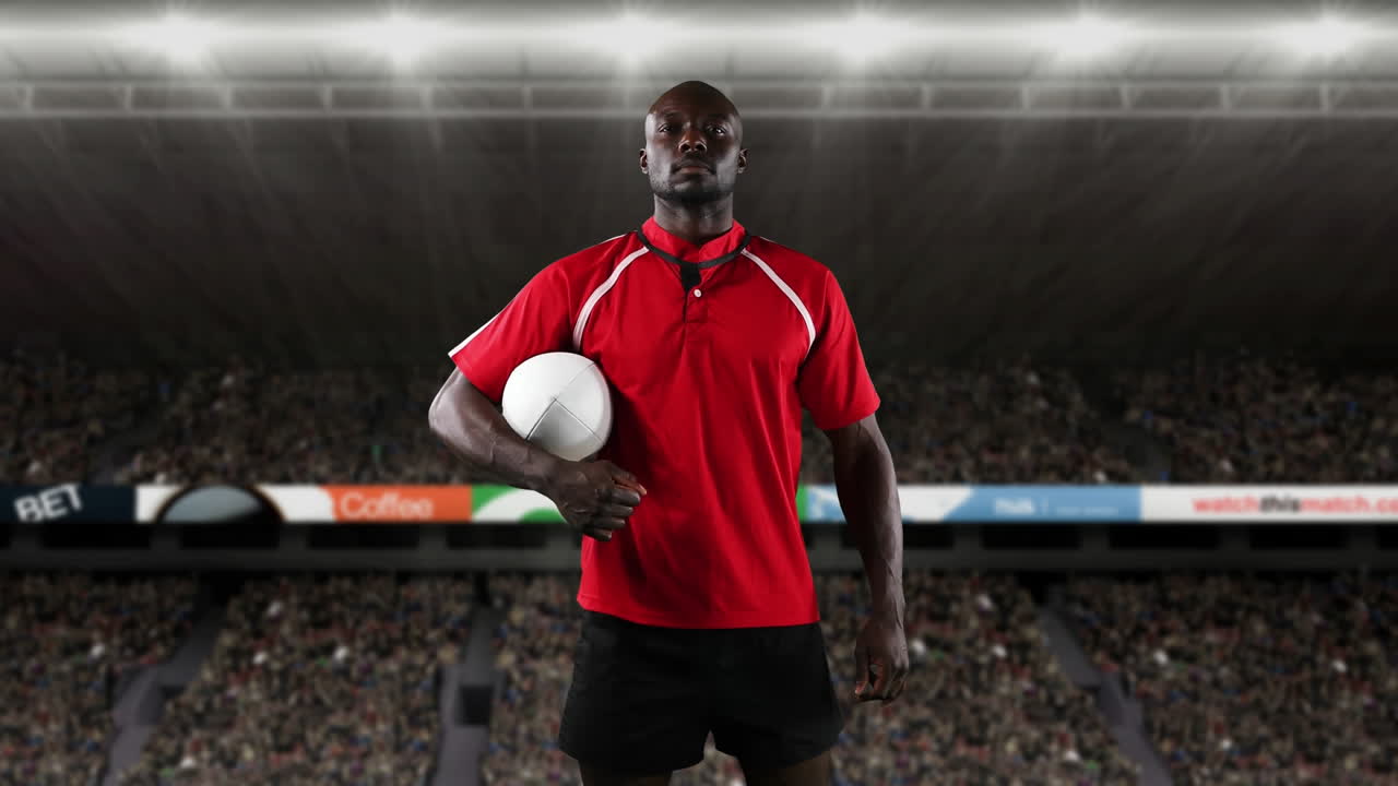 프로 럭비 선수 가 경기장 앞 에 서 있다