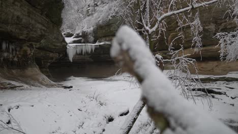 Cave-Entrance-With-Ice-in-Winter-Landscape,-Dolly-Right