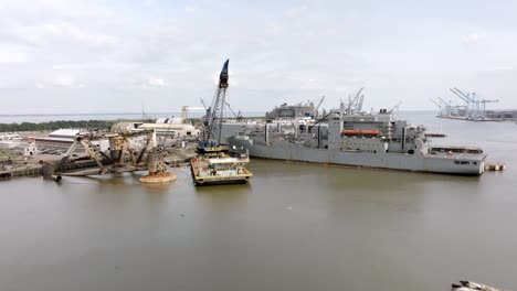 ships and shipyard in mobile bay in mobile, alabama with drone video moving left to right