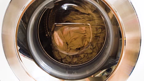 modern washing machine with laundry