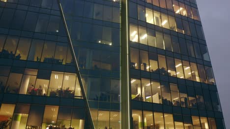 aerial view of the night skyscraper. close-up of office windows in the skyscrapers of the gdansk international business center at night