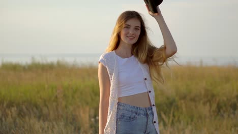 woman in a field at sunset