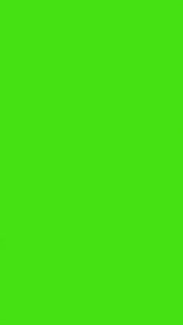 Vertical-Video-Silhouette-Of-Businessman-Wearing-Suit-Walking-Across-Frame-Against-Green-Screen-Background