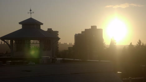 a glimpse of vancouver city while travelling in the famous millennium line on a glowing sunrise - medium shot