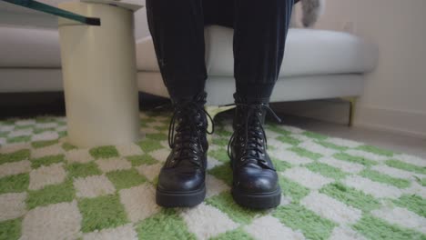 Girl-putting-Boots-on-and-Tying-her-Laces