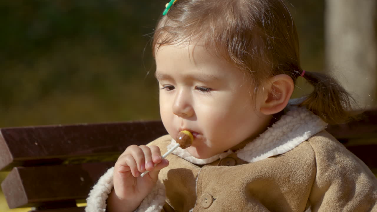 Little Girl Sucking Happy Lollipop In Slow Motion Free Stock Video Footage Download Clips Food