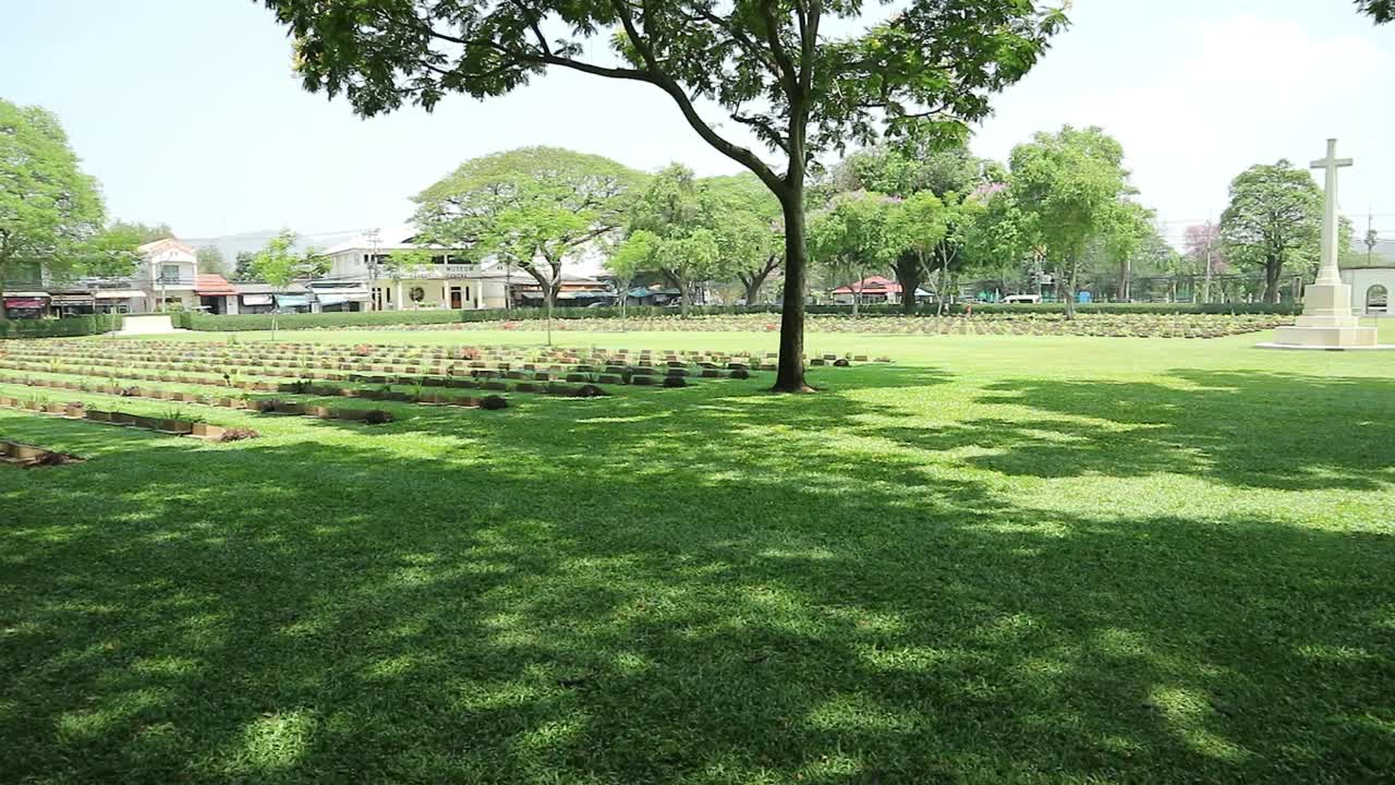 HD Static Shot of World War Two Memorial Graveyard with Headstones of Prisoners of War in a Peaceful Cemetery in Kanchanaburi, Thailand.