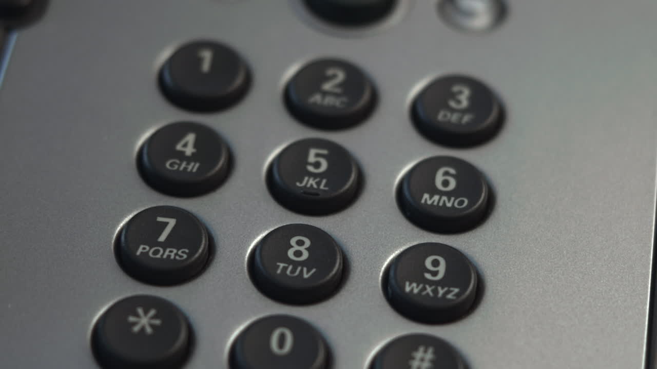 Dialing Numbers On Telephone Keypad Closeup Of Receptionists Finger Pressing Numeric Buttons On Silver Office