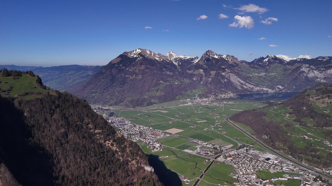 Glarus city Swiss Alps mountain resort holiday destination valley aerial drone view