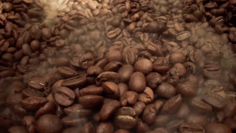 close up of seeds of coffee. fragrant coffee beans are roasted smoke comes from coffee beans.