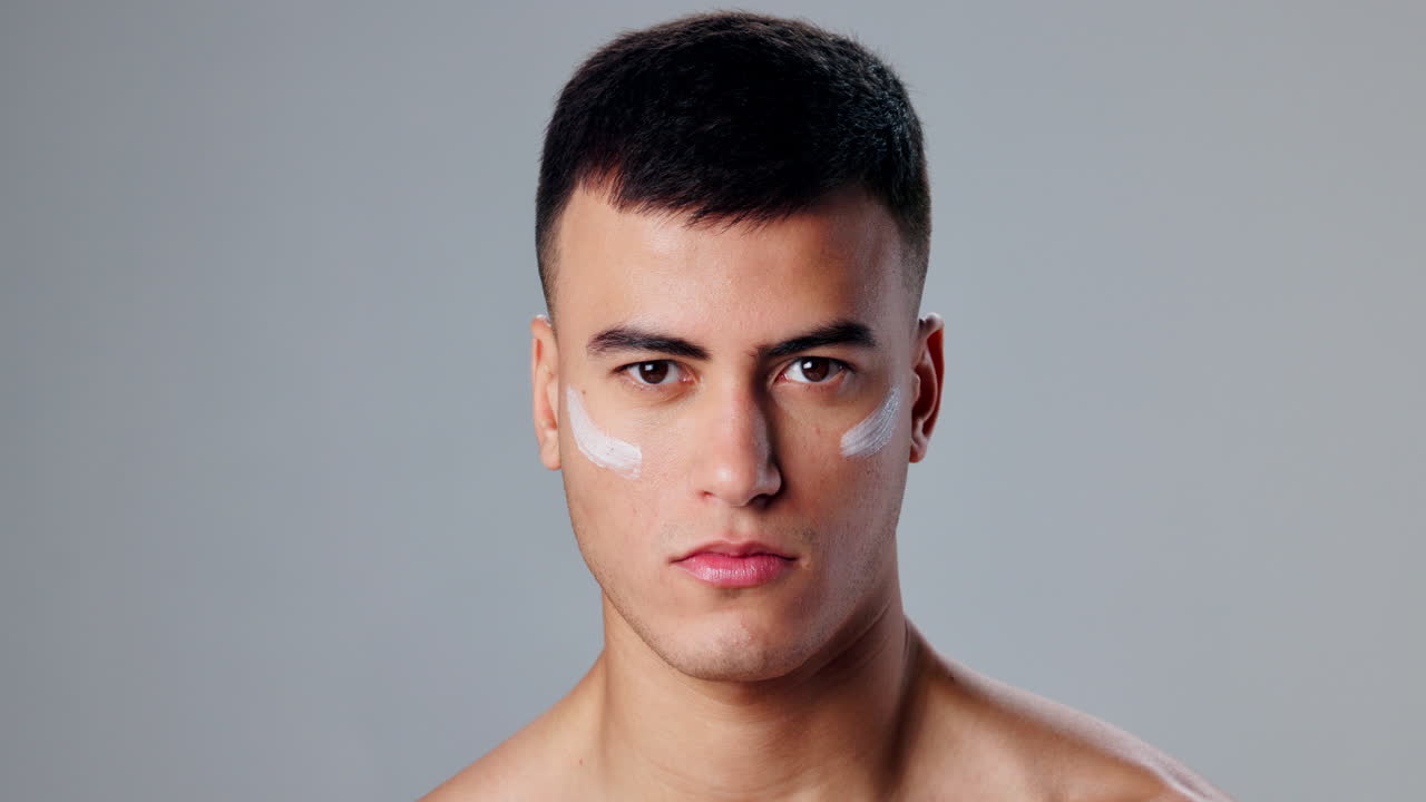 Man with skincare cream on his face