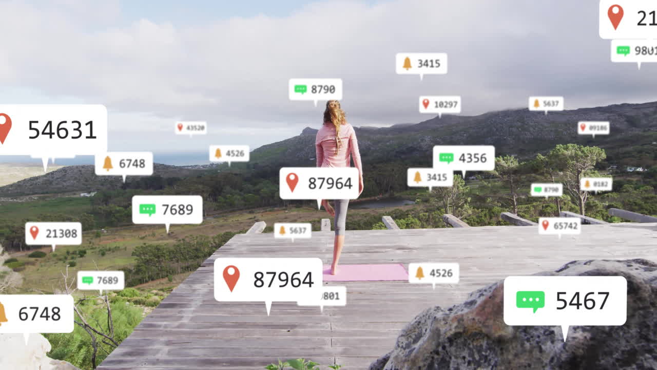 Yoga practitioner balancing on pink mat on wooden deck, using fitness tech with AR UI overlays