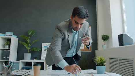 businessman on phone discussing documents