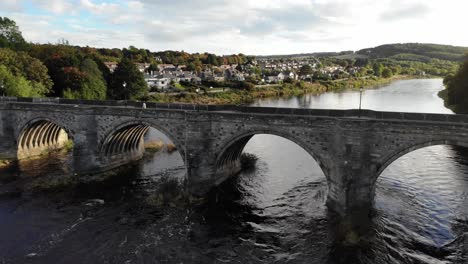 flying away drone shot of the king george vi bridge is a bridge over the river dee in aberdeen, scotland