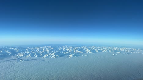 Exploring-the-snowy-Pyrenees-mountains-from-above-at-10000m-flying-from-France-to-Spain