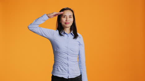 patriotic woman showing military salute gesture