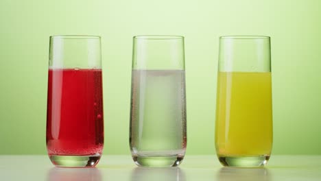 different colored drinks reacting with tablets