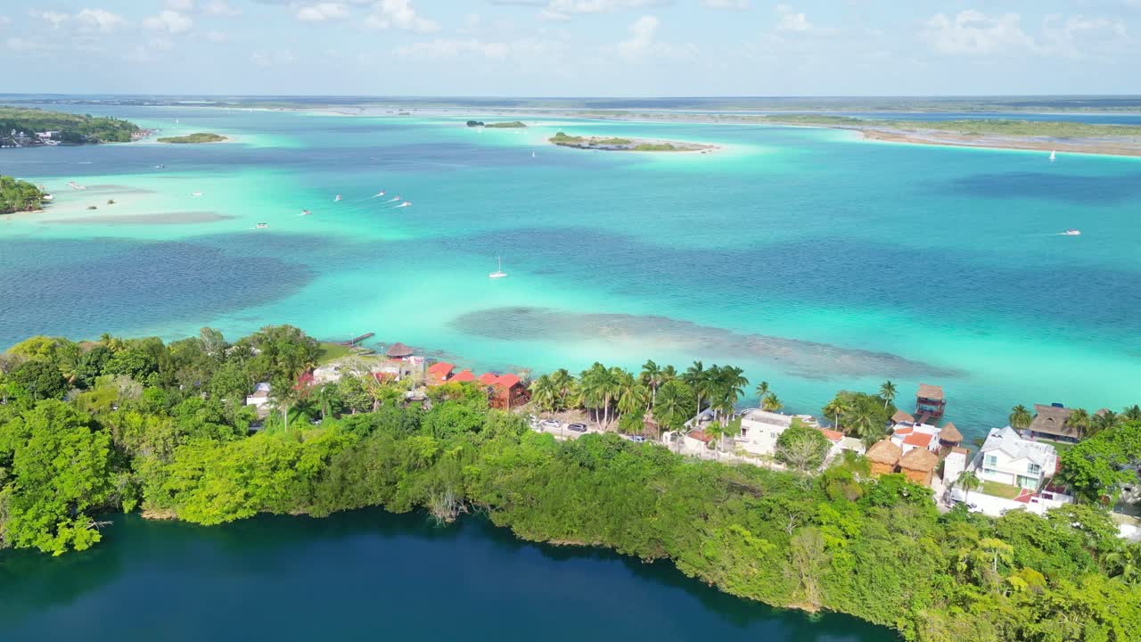 Tropical beach, clear turquoise water, and beautiful coastline view in Bacalar, Mexico