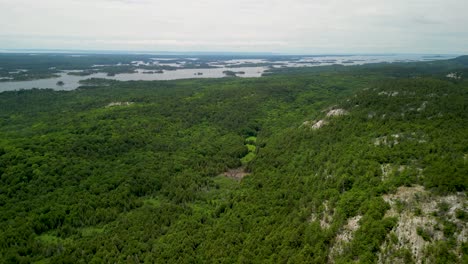 Aerial-view-of-forested-mountainous-area-of-Manitoulin-Island,-Ontario,-Canada