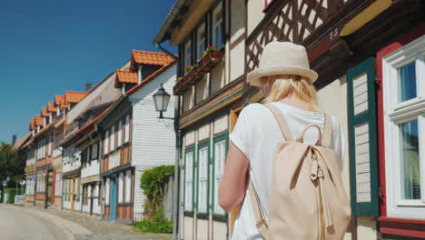 Tourist-With-Smartphone-in-Old-German-Street