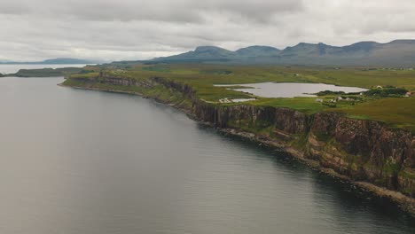 Aerial:-Panning-Shot-Of-Kilt-Rock-Waterfall-From-Over-The-Sound-of-Raasay,-Isle-Of-Skye,-West-of-Scotland,-United-Kingdom