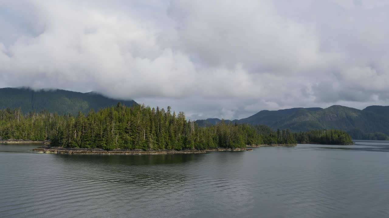 Beautiful landscape around Sitka, Alaska.Small rocky islands covered by dense pine tree forest.