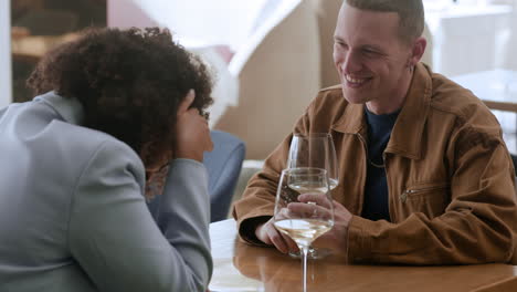 couple enjoying a meal and conversation at a restaurant.