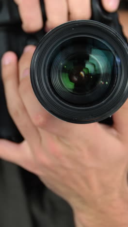 photographer taking photo with professional digital camera