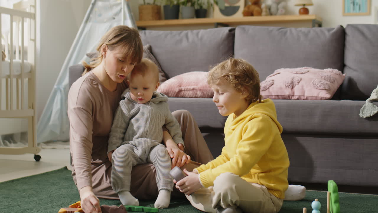 Mom Playing with Little Children at Home