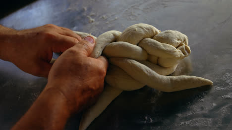 Male-chef-forming-the-layers-of-croissant-dough-4k