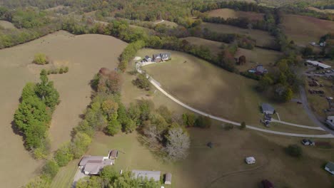 Aerial-orbit-over-the-American-rural-landscape-with-fields-and-farms---early-autumn-in-Tennesee