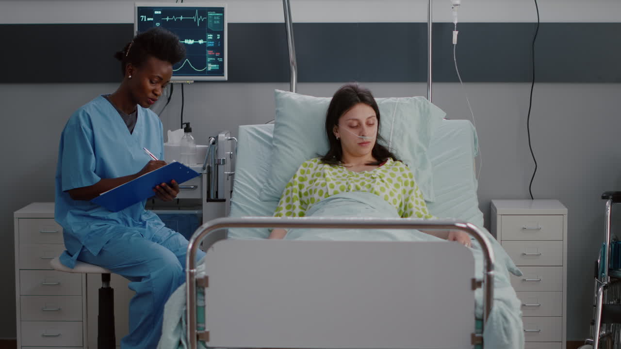 Sick woman adult resting in bed while black nurse analyzing disease expertise
