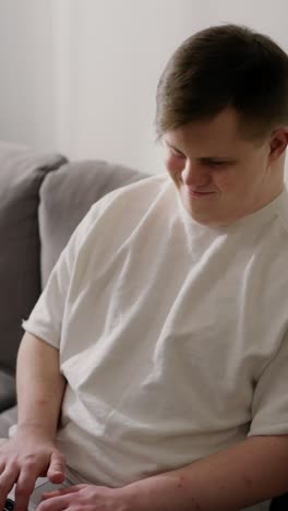 young man using a laptop at home