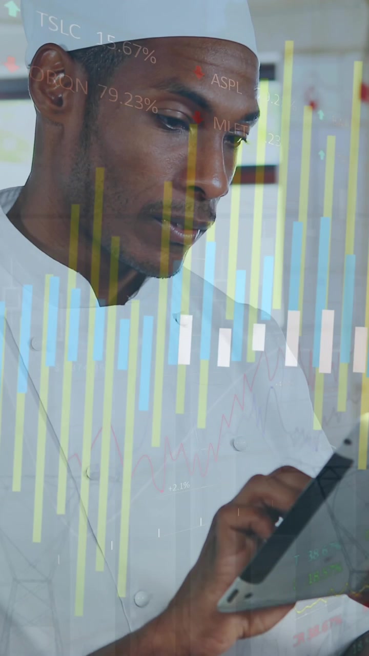 Animation of data processing against african american male chef using digital tablet in the kitchen