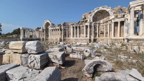 panning across the roman monumental fountain, nymphaeum, in the ancient city of side, turkey