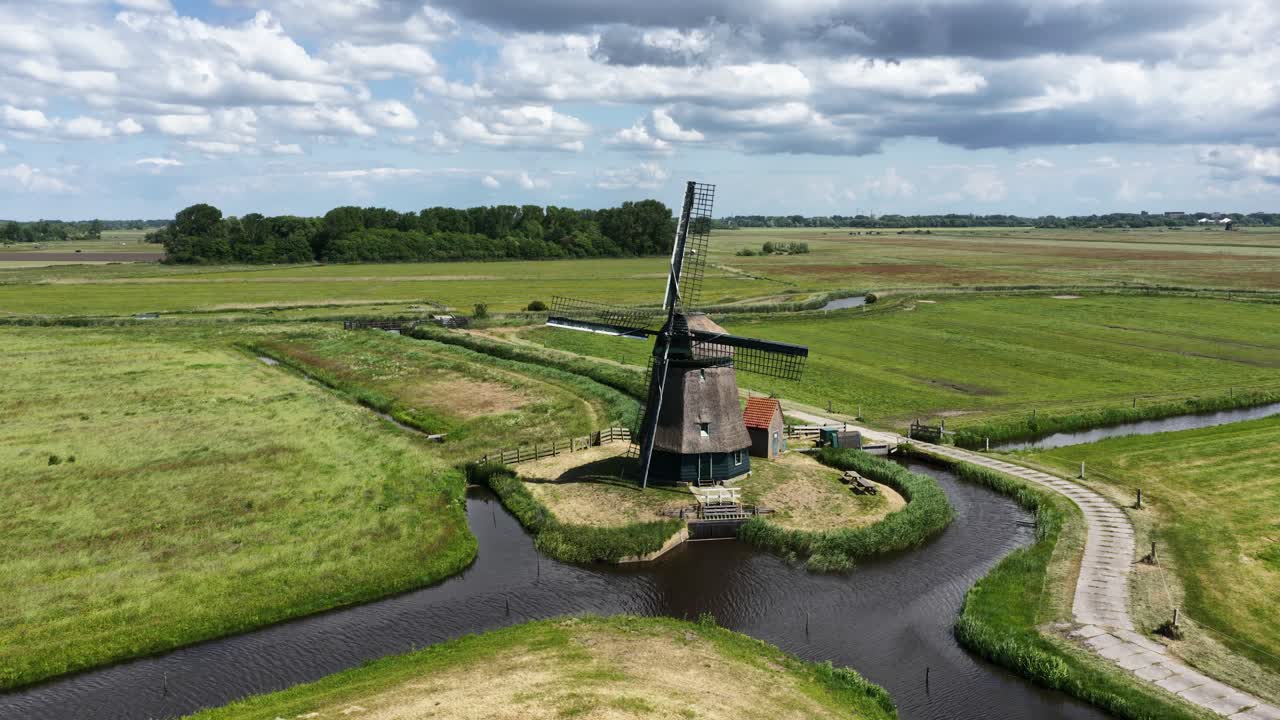 historic wind mill, classic vintage mill, aerial view. dutch culture, aerial droneview.